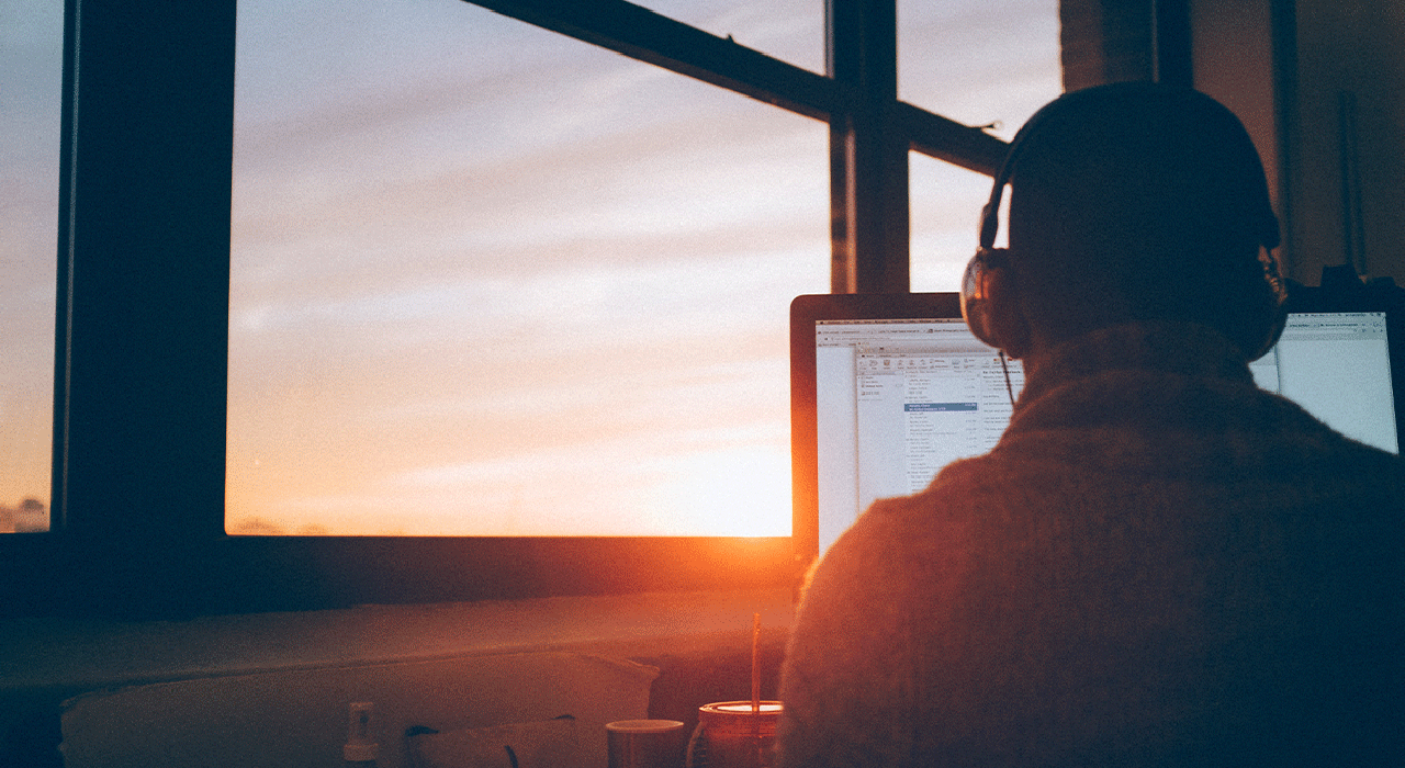 Boy with headphones watching webinar