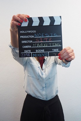 Woman with a clapperboard